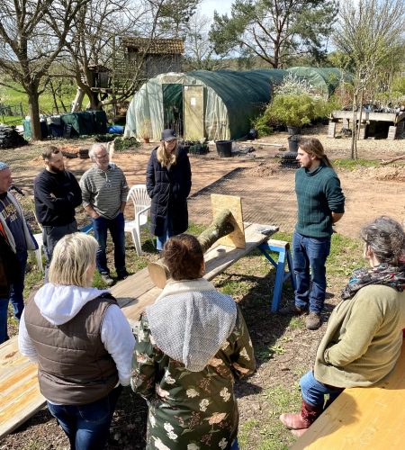 Instructor demonstrating mushroom cultivation techniques to students
