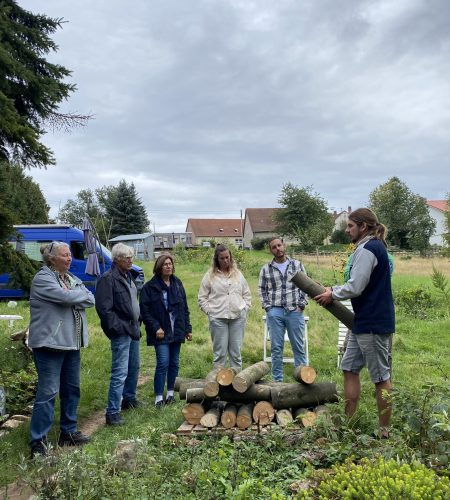 Group of students learning mushroom cultivation in a workshop setting